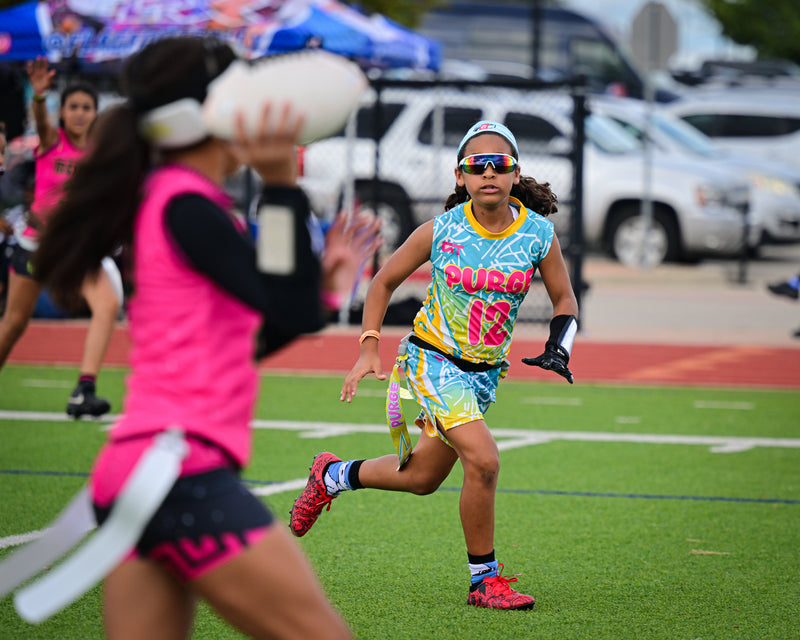 Girls flag football game action